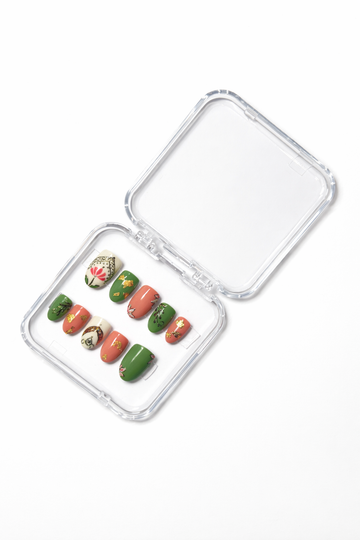 Hand-painted floral press-on nail set with green, peach & gold accents 🌿🌸✨