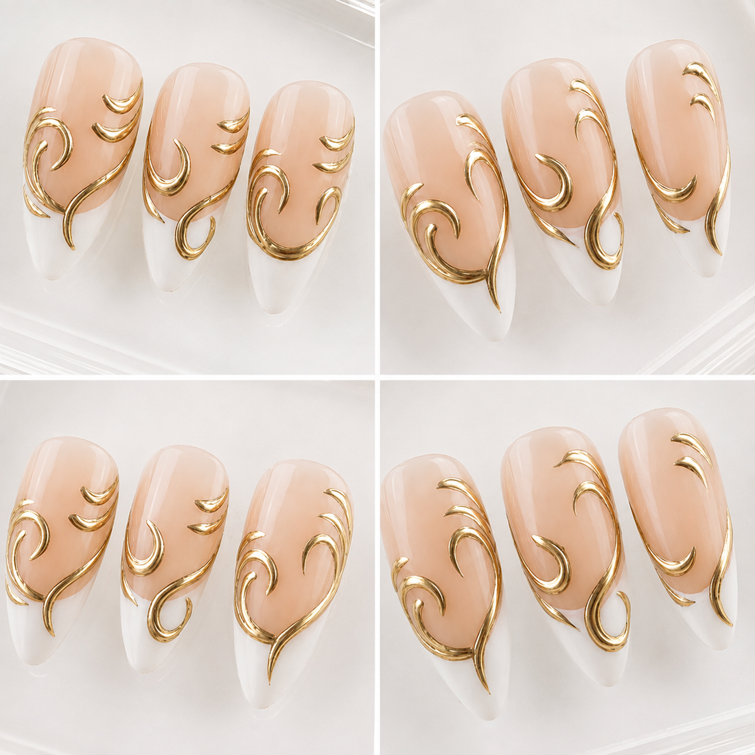 Ten almond-shaped press-on nails arranged in two rows on a light beige textured surface. The nails feature a glossy nude-peach upper half with a white lower half and elegant metallic gold scrollwork designs.