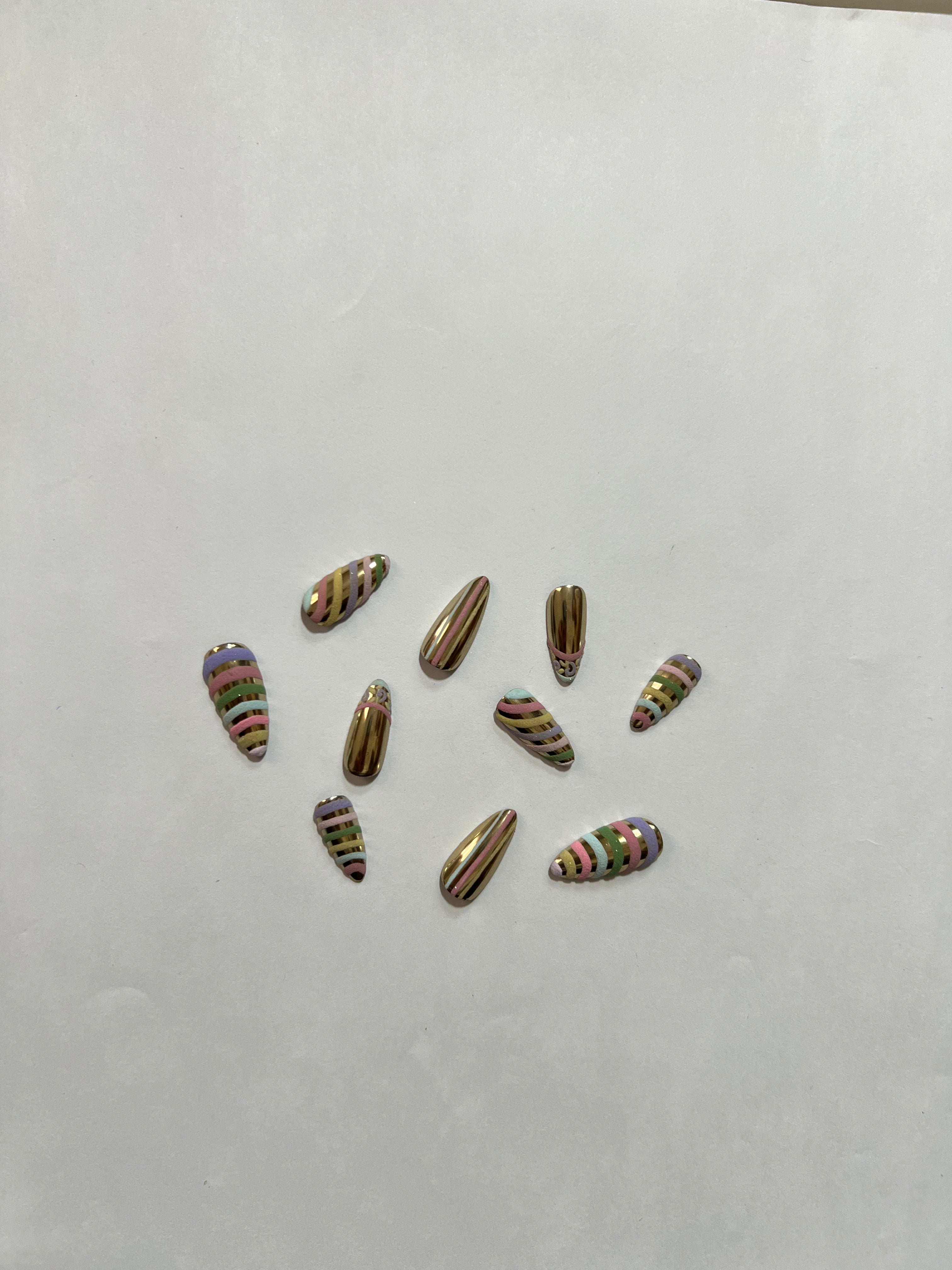 Golden Candy Swirl Nails