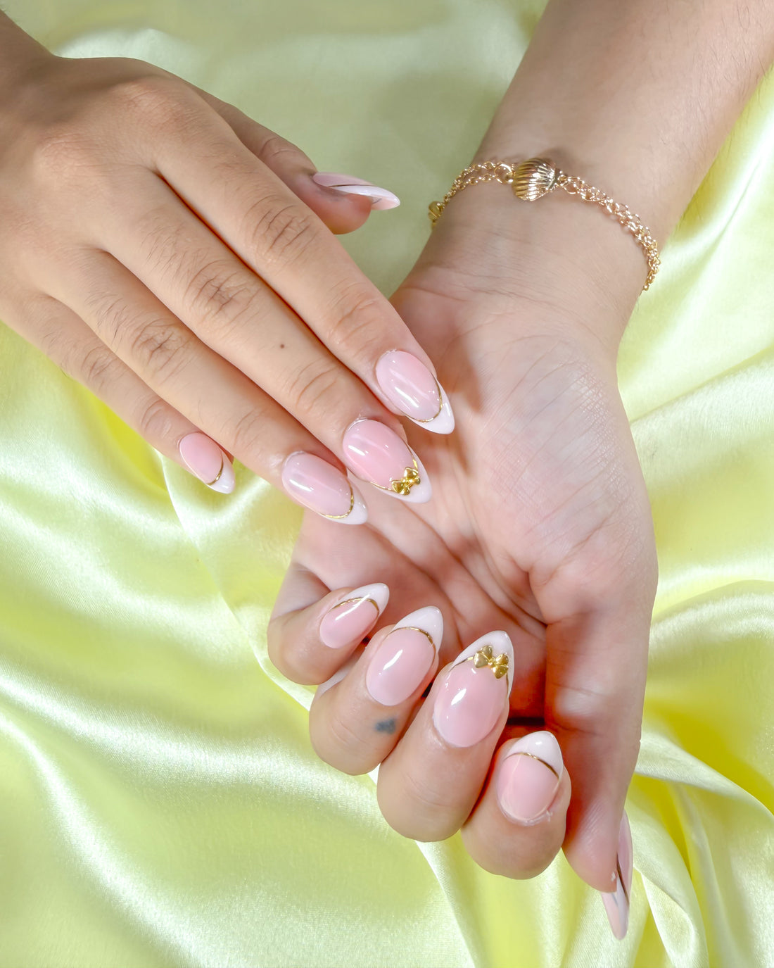 Cute gold bow handmade reusable press on nails by Glossora